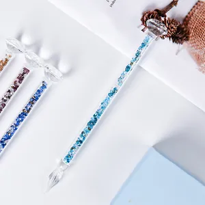 Exquisite handmade glass dip pen featuring blue diamond crystal filling and diamond topper