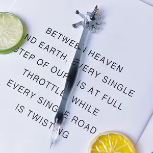 Handmade glass dip pen with unicorn top decoration and elegant translucent grey finish