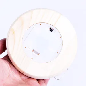 Back view of round wooden base for preserved flower glass dome lamp with battery compartment