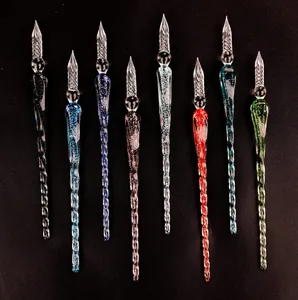 Elegant set of 8 colorful luminous handmade glass dip pens presented on a dark background