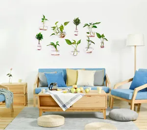 Wall-mounted glass terrariums for hydroponic plants in a modern living room setting