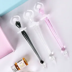 Elegant glass dip pens with artistic ballet dancer design in black, clear and pink