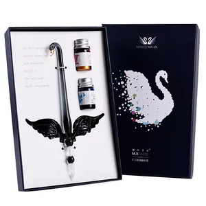 Handmade glass dip pen gift set with swan motif and two bottles of colored ink