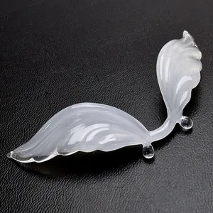 Elegant handmade white swan glass pen rest for calligraphy dip pens on black texture