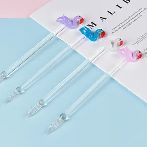 Set of four elegant colorful glass dip pens featuring handmade flamingo toppers.