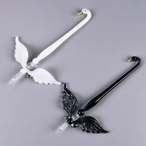 Handcrafted swan-shaped glass dip pen set in elegant black and white finish