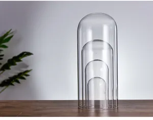 Close-up detail of four nested transparent glass domes for DIY micro landscape display box