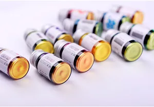 Macro view of various shimmering dip pen ink bottles with vibrant metallic colors