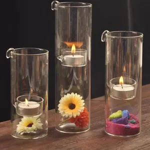 Creative set of three handmade cylindrical glass candle holders with hanging hooks