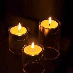 Romantic glass tea light candle holders for dinner or wedding table decor.