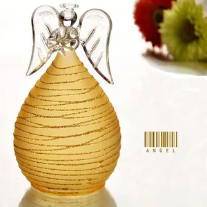 Handcrafted frosted yellow glass angel figurine with sparkling gold glitter accents