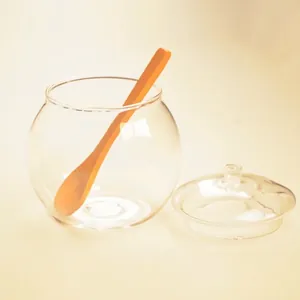 Clear borosilicate glass sugar jar with lid and wooden spoon for kitchen storage