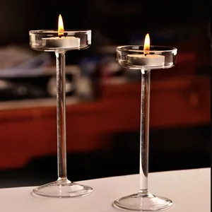 Elegant long-stemmed glass candle holders for a romantic dinner table centerpiece