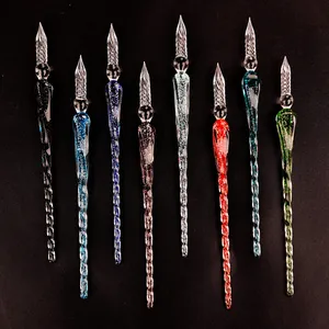 Collection of professional handcrafted luminous glass dip pens in vibrant glitter colors