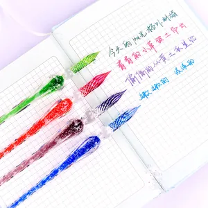Set of four handmade luminous glass dip pens with spiral design for calligraphy writing