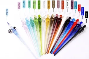 Detailed display of colorful handmade glass dip pens arranged in an elegant fan shape