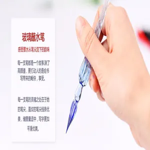 Close-up detail of a hand holding an elegant glass dip pen with a blue spiral tip
