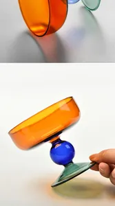 Detail showing the vibrant orange, blue, and green colors of the glass dessert cup