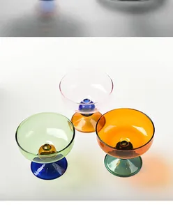 Set of colorful glass dessert bowls with high stems for ice cream, snacks, or yogurt