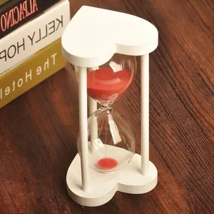 Heart-shaped white wood frame glass hourglass with red sand for home office decor