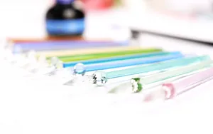 Colorful handcrafted glass dip pens with elegant spiral nibs for calligraphy