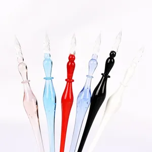 Handcrafted elegant glass dip pens in multiple colors showing spiral writing nib details
