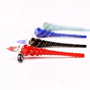 Detailed view of colorful spiral glass dip pens in red, black, and blue tones.