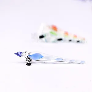 Handcrafted spiral glass dip pen with elegant blue and white twisted ink design