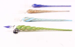 Handcrafted spiral glass dip pens in assorted vibrant colors with shiny gold glitter