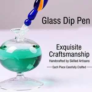 Artistic handmade glass dip pen set with turquoise ink bottle, perfect for creative writing gifts