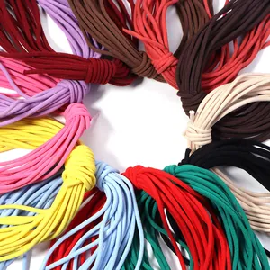 Close-up detail view showing colorful elastic cords and drawstrings arranged in a neat circle.