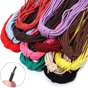 Close-up detail shot of colorful elastic cords, showing texture and tip craftsmanship clearly.