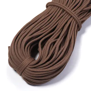 Close-up detail of brown elastic cord, neatly coiled for DIY sewing crafts, waistbands and hoodies.