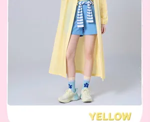 Detail view of a lightweight yellow EVA raincoat for adults outdoor travel use.