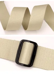 Close-up detail of durable beige nylon webbing strap with black rectangular metal slider buckle.