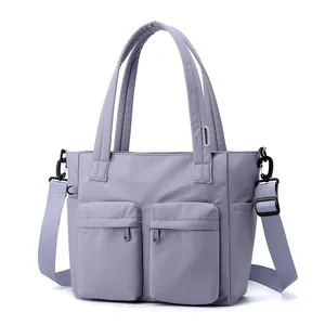 Waterproof nylon women tote bag casual shoulder crossbody handbag with front pockets.