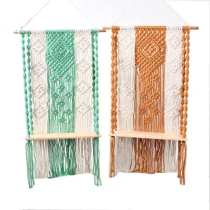 Macrame wall hanging shelf detail close up bohemian woven cotton cord wooden board