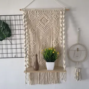 Bohemian handmade macrame wall hanging shelf with wooden board for home and room decor.
