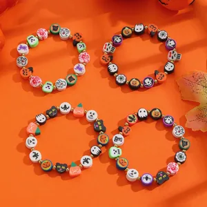 Detailed view of colorful Halloween themed clay bead bracelets with holiday patterns
