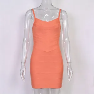 Detailed view of an orange bandage bodycon dress with textured ribbing for party wear