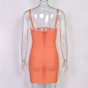 Close-up detail of the back zipper on an orange bodycon bandage party mini dress