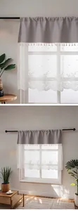 Close-up detail of the grey spliced floral lace sheer curtain with delicate tassel trim.