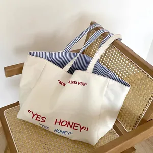 Large capacity canvas tote bag with striped lining and chic embroidered letters for women