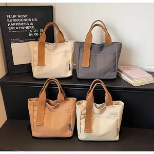 Borsa tote in tela tinta unita stile coreano borsa casual da commuting quotidiano tasca anteriore.