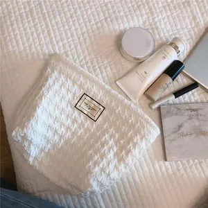 White textured cosmetic bag portable travel makeup pouch minimalist aesthetic clutch organizer