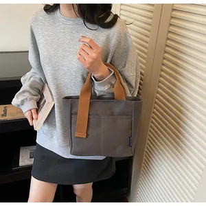 Borsa a secchiello in tela tinta unita casual con manico a contrasto, borsa pratica.