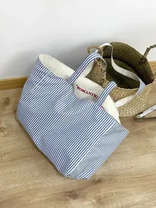 Korean canvas tote bag with blue and white stripes and chic embroidery for daily use.
