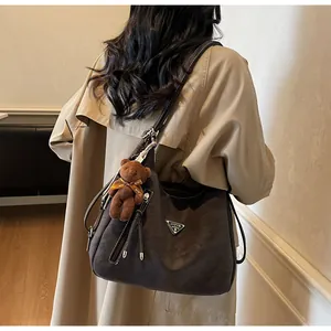Vintage brown retro women shoulder backpack detail, large capacity casual daily commuter handbag.