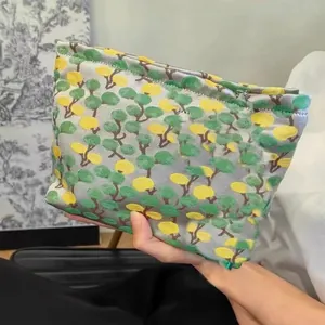 Vintage artistic portable cosmetic pouch with elegant embroidered tree pattern, ideal for daily use.