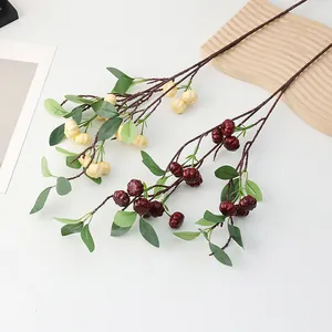Artificial mini pumpkin branches detail, autumn harvest and Halloween festival decoration props.